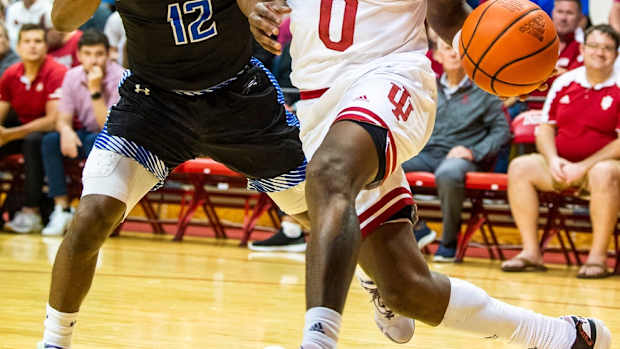 Indiana's Xavier Johnson (0) drives past St. Francis' Antwaan Cushingberry (12) during the Indiana versus St. Francis men's basketball game at Simon Skjodt Assembly Hall on Thursday, Nov. 3, 2022.